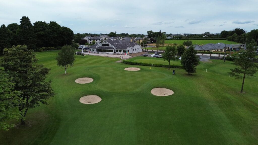 Aerial view of the Roscommon Golf Club clubhouse and course